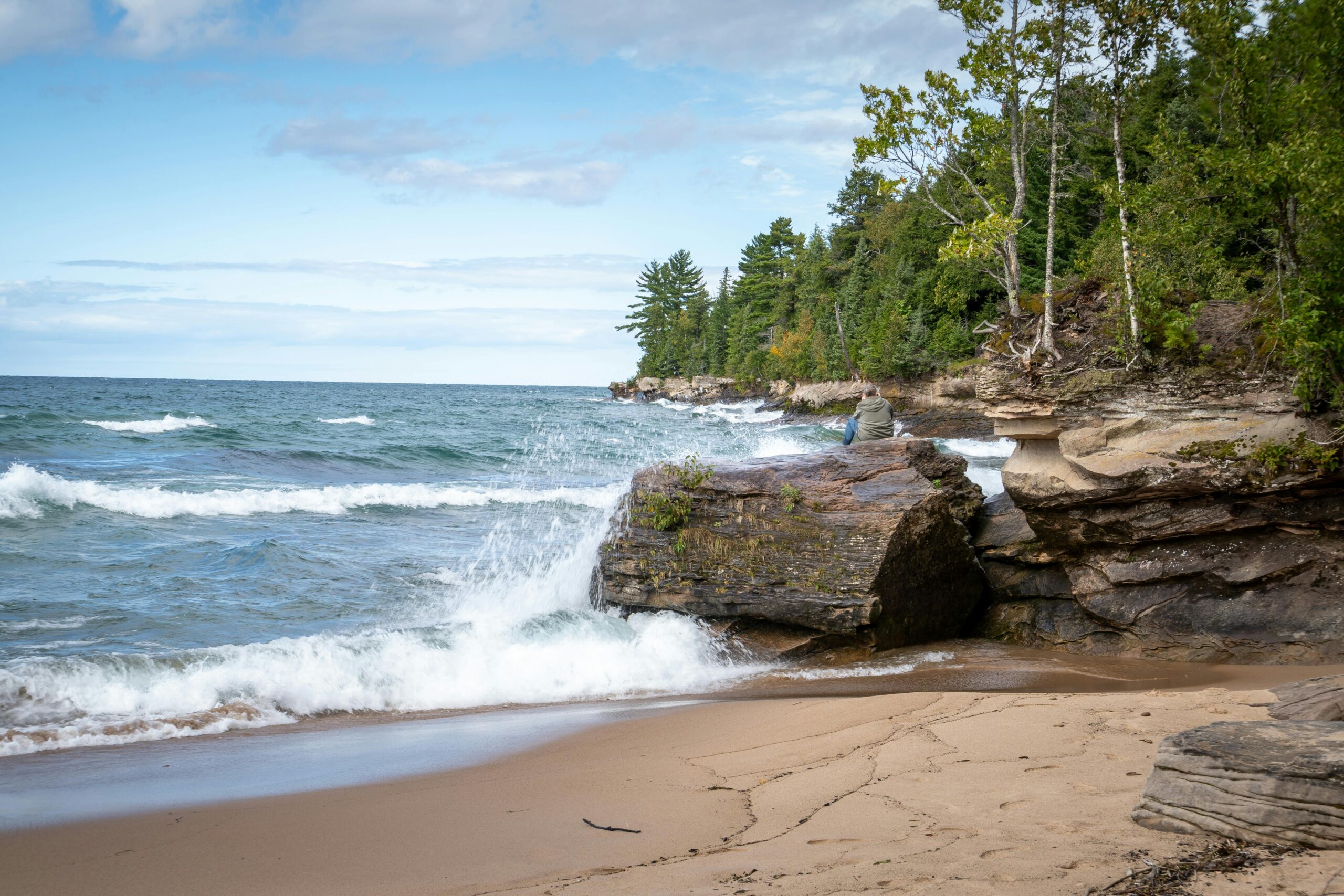 Scenic Northern Michigan shoreline during the first day of spring, showing healthy mixed timber stands along the Lake Superior coast near Traverse City and Petoskey.
